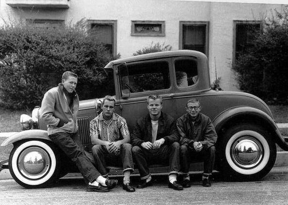 1950s Teens Enjoying a Leisurely Time on Their Chic Automobile