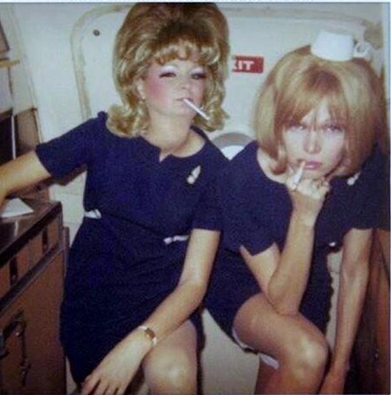 Flight Attendants in 1973 Enjoy a Quick Cigarette Break aboard a Plane