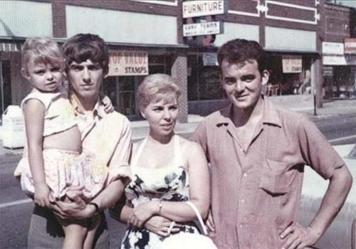 George Harrison poses with his niece Leslie alongside his siblings Lou and Peter in Illinois, 1963.
