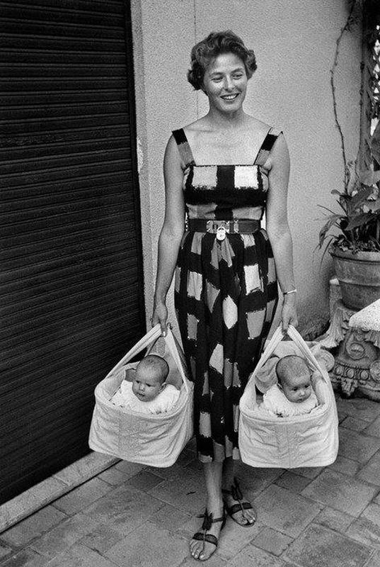 Ingrid Bergman poses with her twin daughters Isabella and Isotta Rossellini in Italy, 1952.