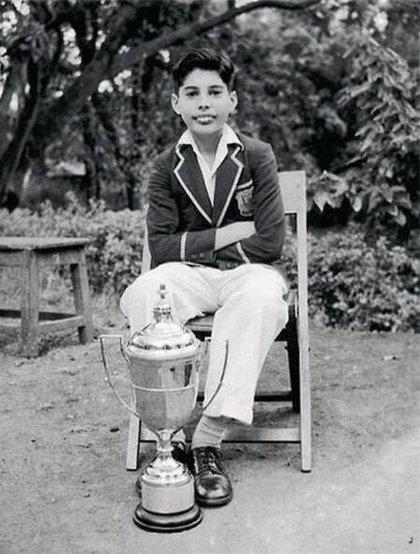 Freddie Mercury, also known as 12-year-old Farrokh Bulsara, holds his Junior All-Rounder trophy at his school in Bombay in 1958.