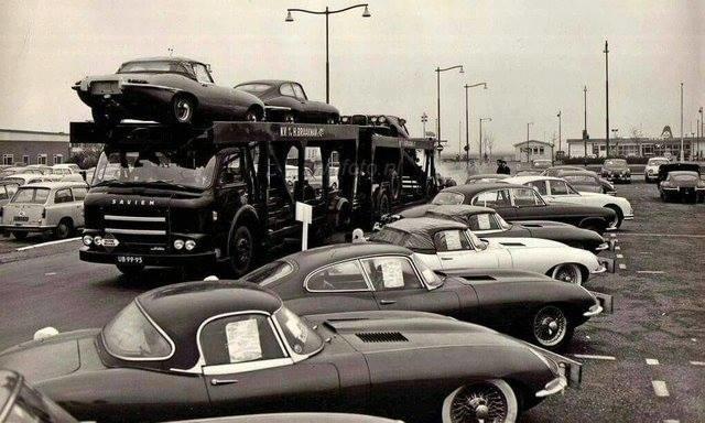 1960s car lot brimming with Jaguars.