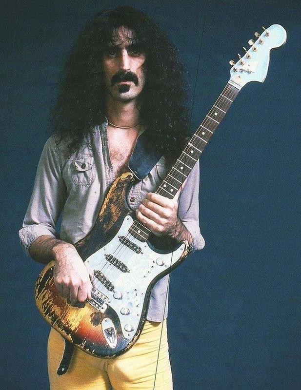 Frank Zappa in possession of Jimi Hendrix's burnt Stratocaster guitar, gifted by the late musician (1977)