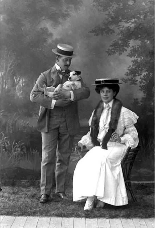 Swedish couple adorably poses with their beloved dog in a charming 1905 photo.