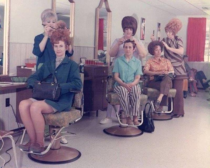 Women in the 1960s embracing teased hairstyles