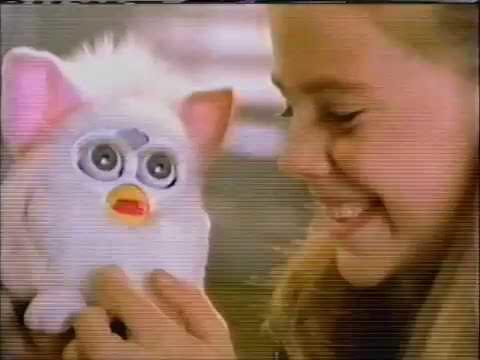 The '90s Phenomenon: Furbys, the Captivating Electronic Pets that Delighted Kids and Adults Alike with Expressive Eyes, Playful Language, and Learning Abilities, Providing a Magical Journey of Companionship.