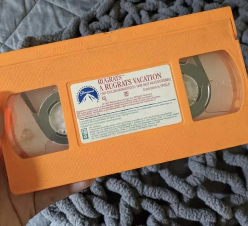 Brightly-Colored Tapes on Video Store Shelves: Instantly Engaging Film Lovers and Inspiring Thrill for Legendary Movies