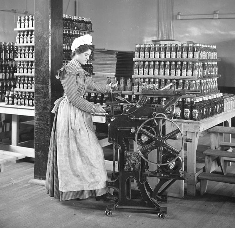 1897: Original Heinz Factory Employee Engaged in Ketchup Bottling