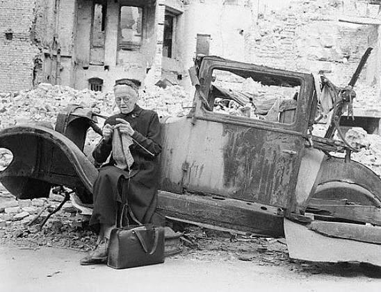 Woman Knitting Endures Amidst the Ruins of Berlin in 1945