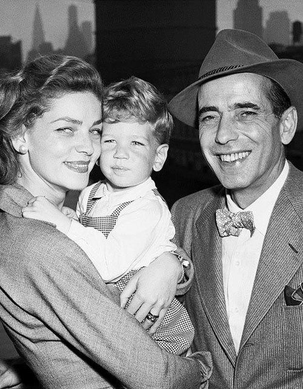 A 1951 photograph captures Humphrey Bogart and Lauren Bacall with their son, Stephen.