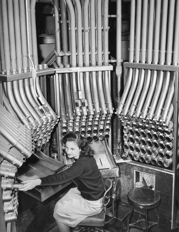 Helen Soros Operates New Pneumatic Tube System for Cash Transactions at Marshall Fields Store in Chicago, 1947