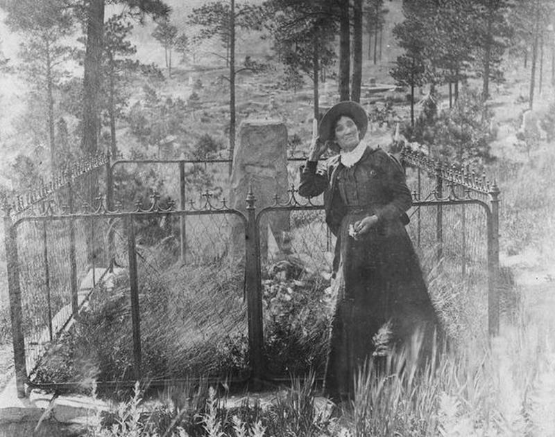 Calamity Jane Pays Tribute to Wild Bill Hickok at Burial Site in Deadwood, South Dakota in the 1890s.