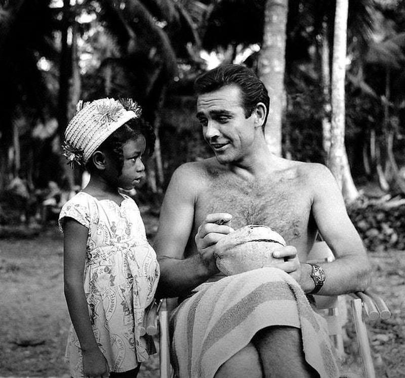 Sean Connery signs coconut for young fan on 'Dr. No' set (1962)