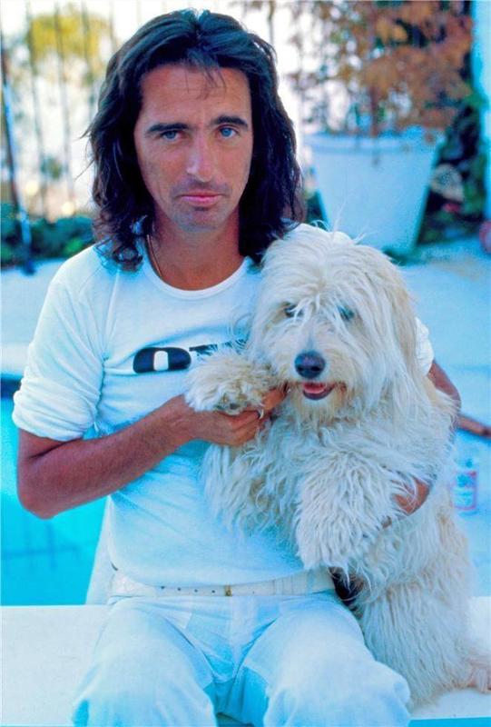 Alice Cooper and his dog at home in LA in 1975.