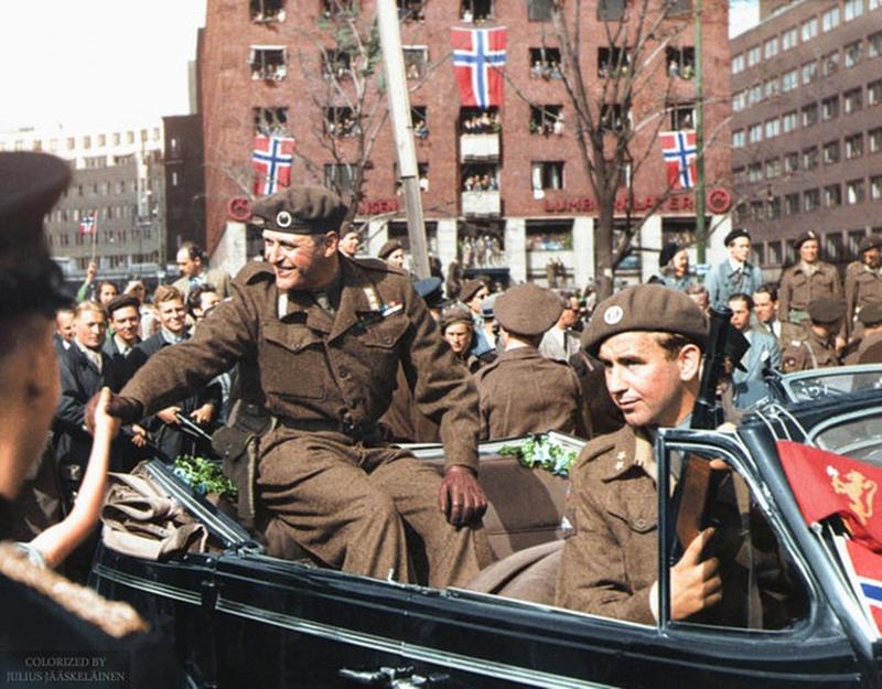 Norwegian Crown Prince Olav drives through Oslo's streets upon return home, accompanied by resistance fighter Max Manus - May 13, 1945.