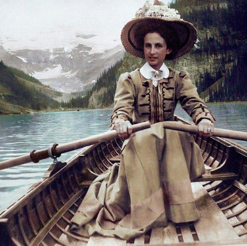 Lake Louise in c.1910 features a woman rowing a boat
