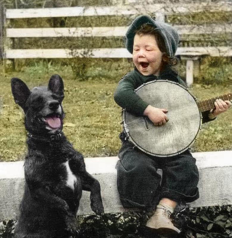 1920: Young Boy and Best Friend Play Banjo