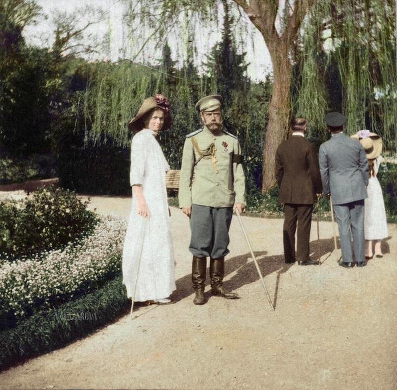 Tsar Nicholas II and Olga, his eldest daughter, pause for a photo during their stroll through the Nikitsky Botanical Gardens in celebration of its centennial, 1912.