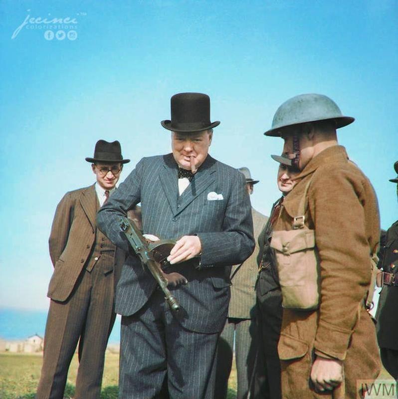 Winston Churchill wields a 'tommy gun' during inspection of invasion coastal defenses near Hartlepool, County Durham, England at 66 years old in 1940 - Notice any resemblance from the previous photo?