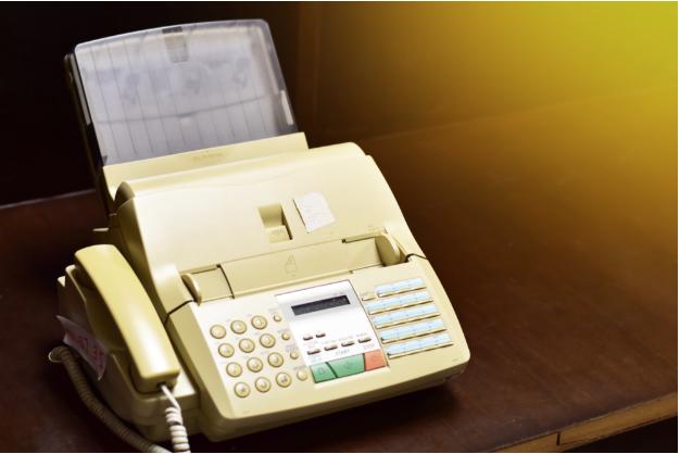 Fax machines, once emblematic of advanced communication in the '80s, became obsolete with the rise of email, leaving behind nostalgic remnants of a time dominated by paper and phone lines for transmitting documents.