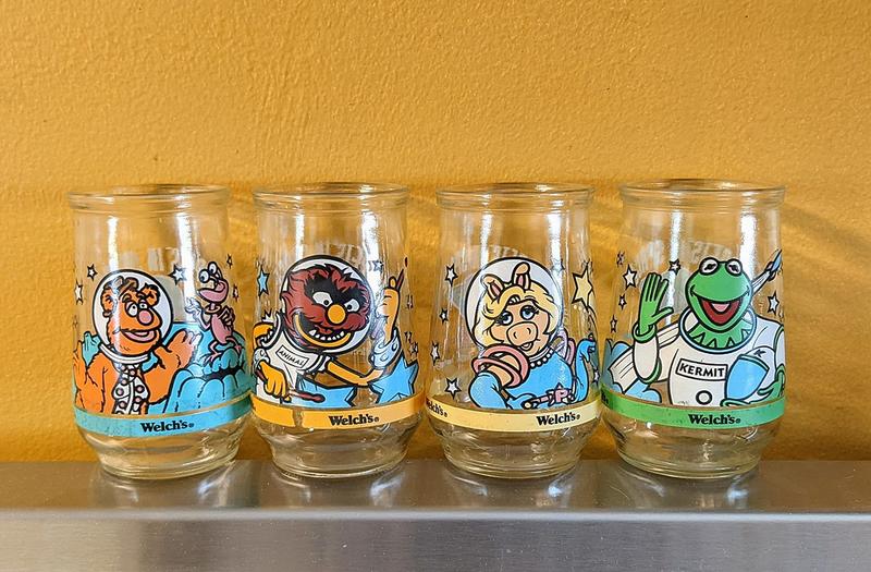 Once sought-after by 1980s families for sipping in a trendy manner, Welch's glasses have now diminished in popularity and are found as mere secondhand store finds, serving as mementos of a past era filled with promotional sentimentality.