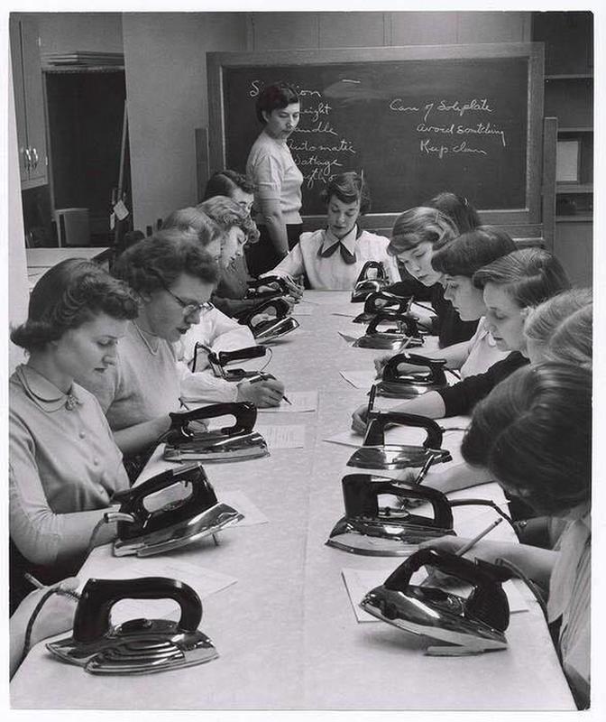 Cornell students master ironing in home economics class, 1951.