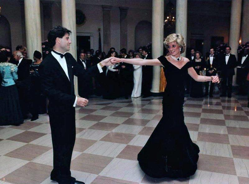 Princess Diana waltzes with John Travolta at White House gala, 1985.