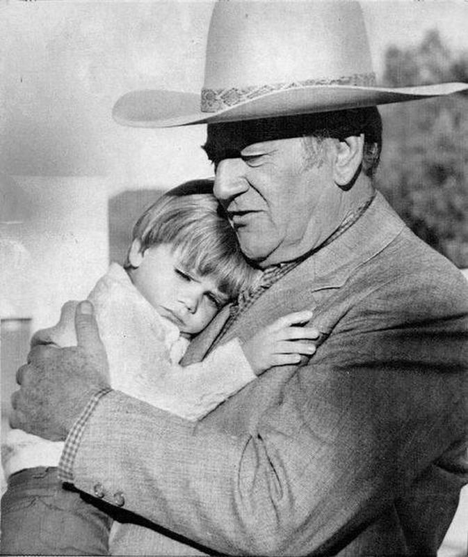 John Wayne and his 3-year-old grandson reunite on The Big Jake set.