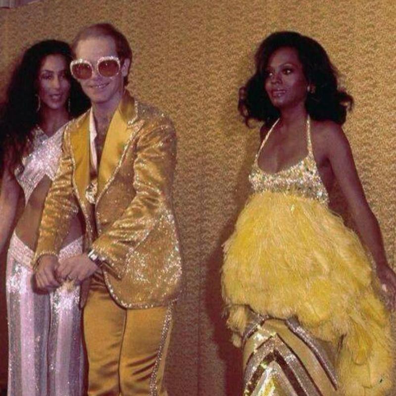 Elton John, Diana Ross, and Cher, iconic musicians, reunite backstage at the 1975 Grammys.