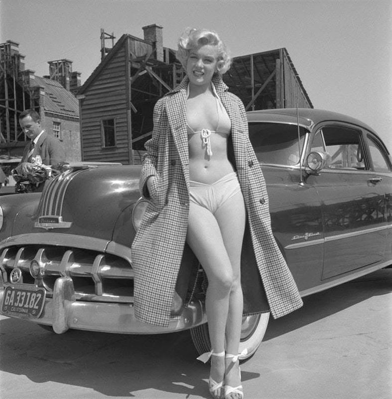 Marilyn Monroe Strikes a Pose with a 1951 Pontiac Chieftain