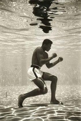 Muhammad Ali, aged 19, trains underwater despite lacking swimming skills. (1961)