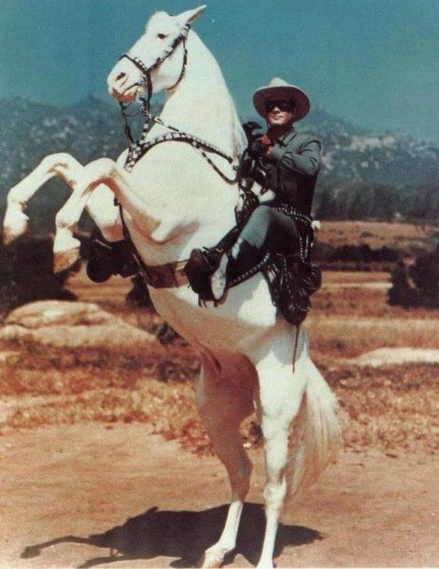 Clayton Moore Embraces Iconic Characters as 'The Lone Ranger' and Silver in 1950