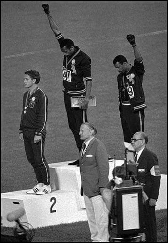 Tommie Smith and John Carlos raise their fists on the Olympic podium during the 1968 Summer Olympics