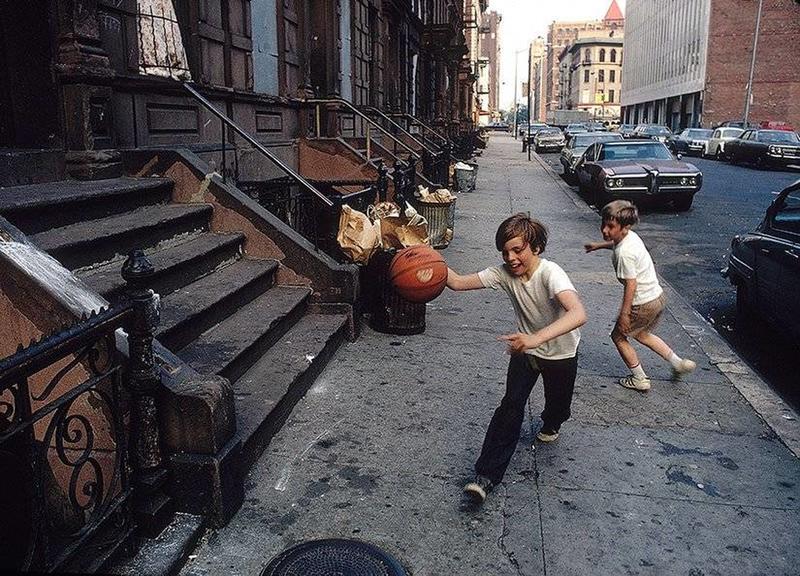 Circa 1970: Boys Engage in Street Ball Game