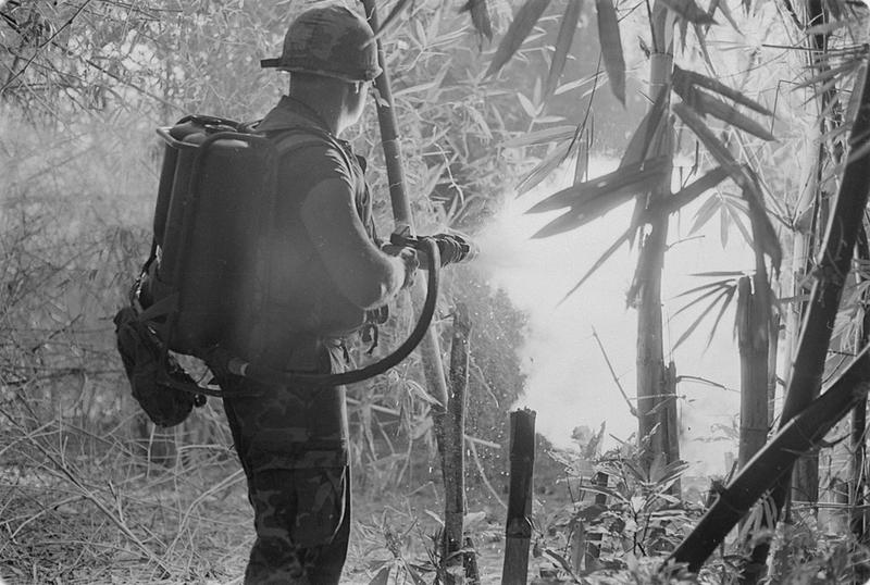 American Soldier Makes Swift Progress Through the Jungle With the Aid of a Flamethrower