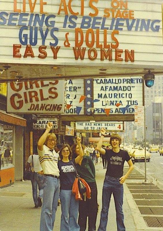 Tourists in the 1970s having a great time at Times Square, striking poses for photos