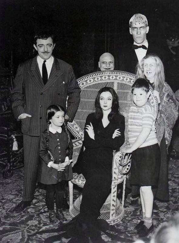 The Addams Family' strikes a candid pose during their 1964 photo shoot.