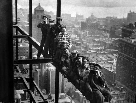 Harmonica Melodies Fill the Air as Workers Serenade Construction of Rockefeller Center Skyscraper in 1932 New York City