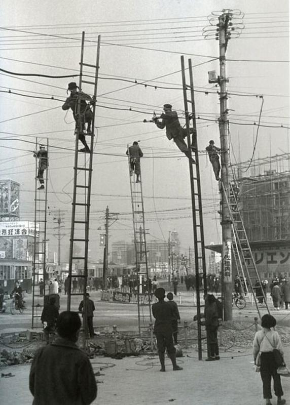 Surprising Surprise Awaits Overhead Powerline Workers in Nagoya, Japan in 1952