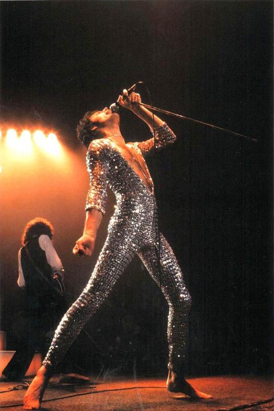 In 1977, Freddie Mercury rocks the stage with an iconic jumpsuit.