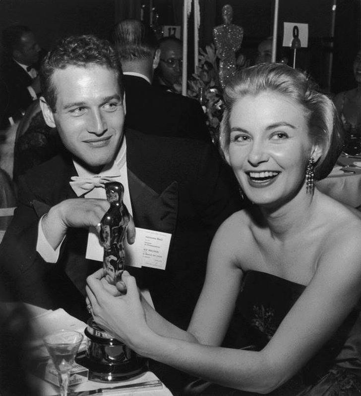 Paul Newman proudly gazes at his wife Joanne Woodward with love at the Governor's Ball in 1958.