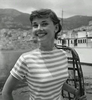 Audrey Hepburn's radiant smile captured by Edward Quinn in 1951.