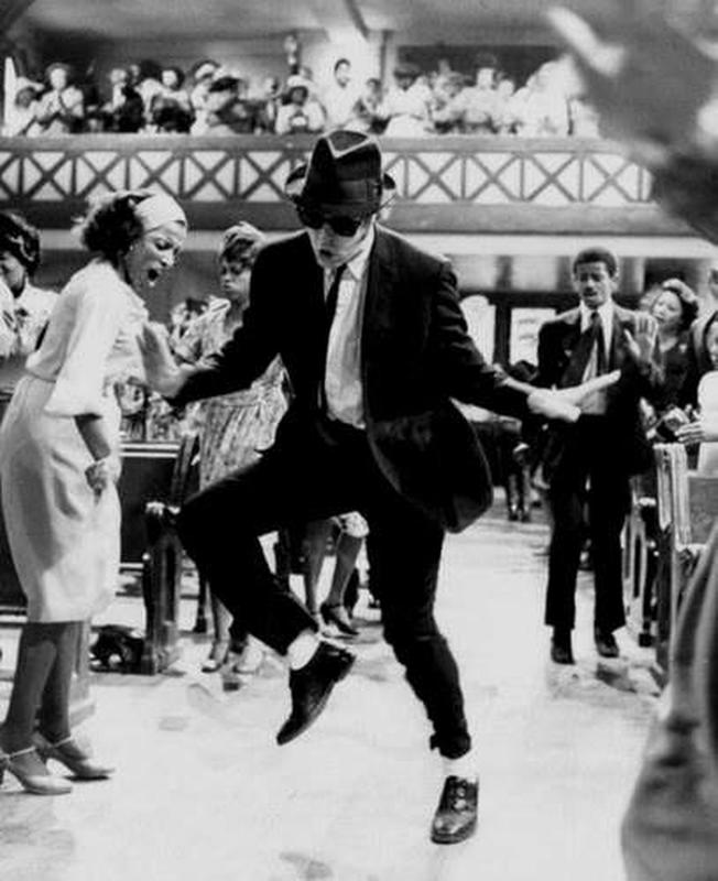 Dan Aykroyd showcases his dance moves in the iconic film 'The Blues Brothers' from 1980.