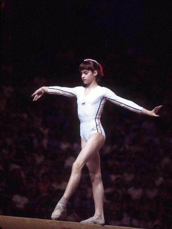 14-year-old Nadia Comaneci Makes History by Winning 3 Gold Medals with 7 Perfect 10 Scores at 1976 Olympics