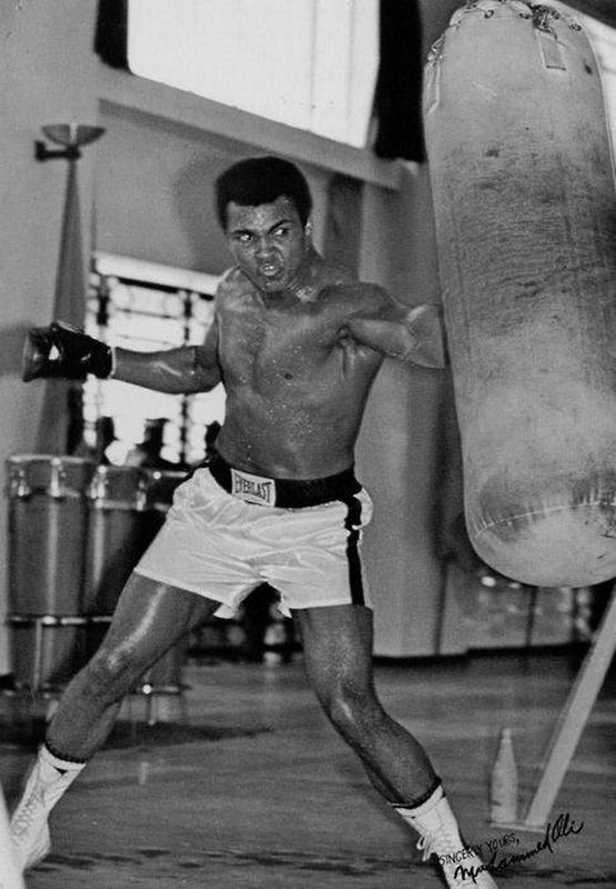 Muhammad Ali, the legendary boxer, seen during intense training session.