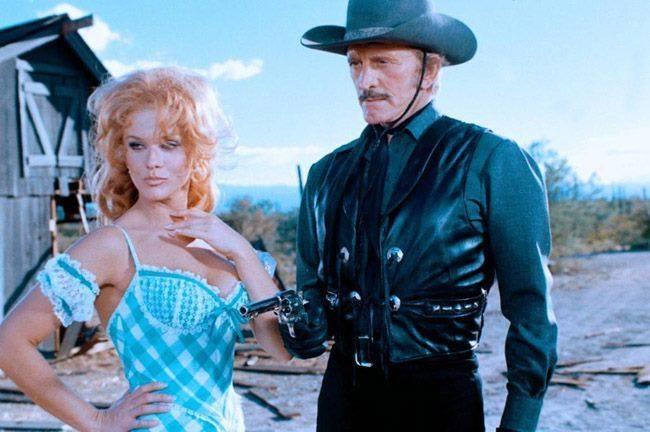 Ann-Margret and Kirk Douglas star in the 1979 comedy-Western, 'The Villain', in an exciting scene.