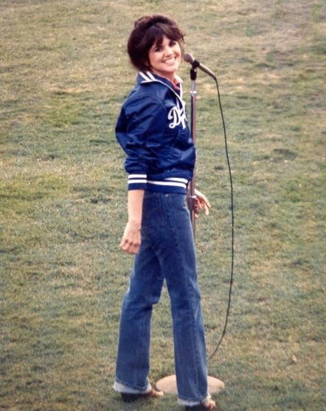 Linda Ronstadt wears a smile as she prepares to perform the National Anthem at Dodger Stadium in 1977.