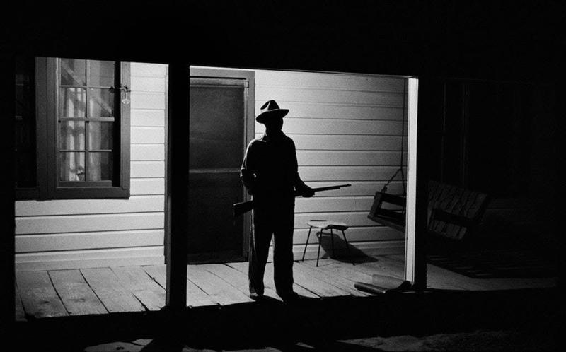 1963: Reverend Carter Bravely Guards Front Porch in West Feliciana Parish, Louisiana, in Anticipation of Ku Klux Klan Visit