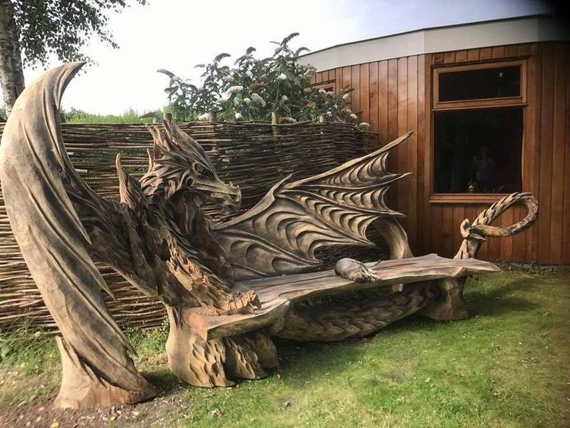 Wooden dragon bench carved with a chainsaw by talented German artist Igor Loskutow